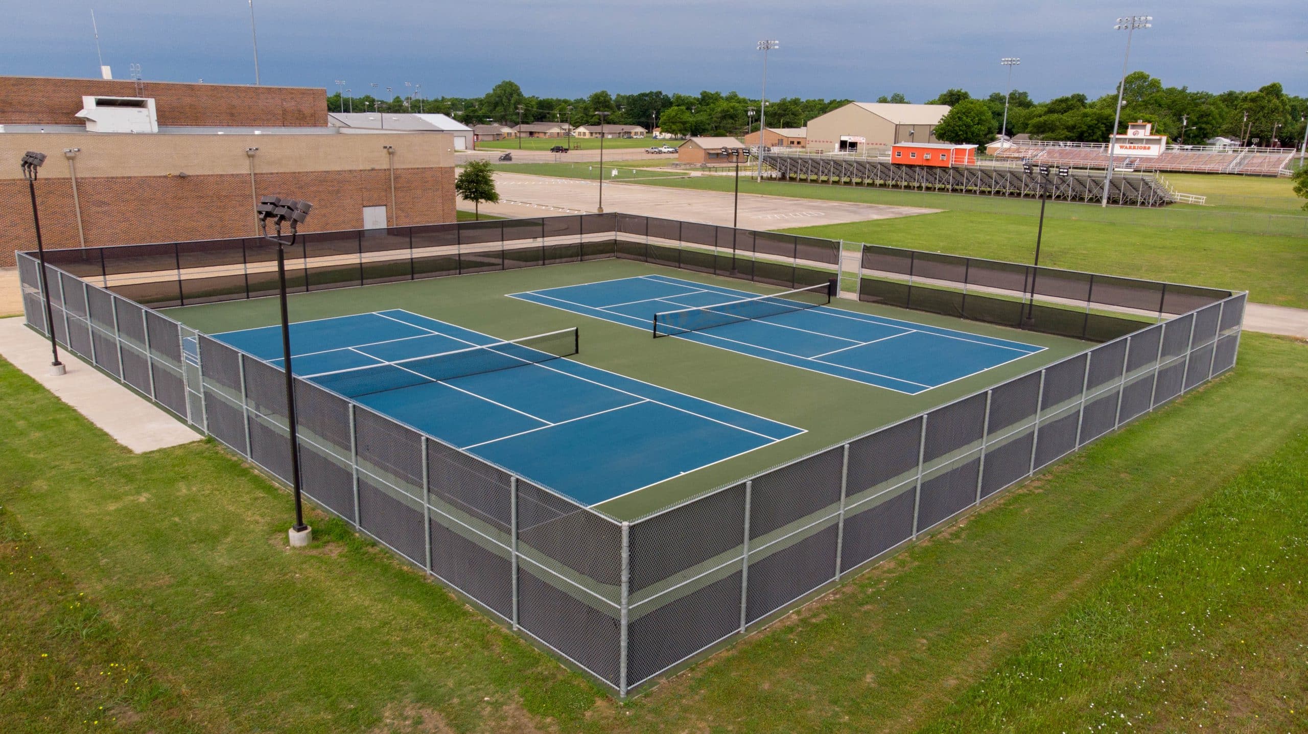 2 tennis courts Honey Grove TX completed by Archer Construction & Design