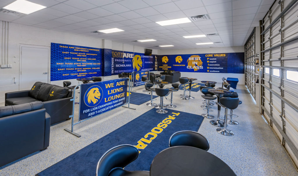 Completed Texas A&M University Commerce commercial renovation of Lions Lounge with multiple leather couches and barstools