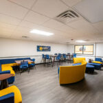 Texas A and M Commerce completed construction of study area with yellow and blue furniture