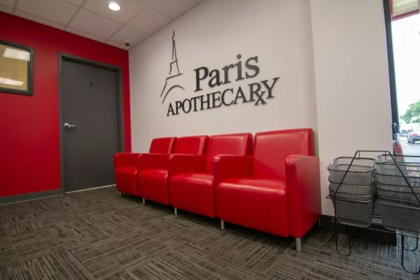 Paris Apothecary pharmacy construction - seating with red couch